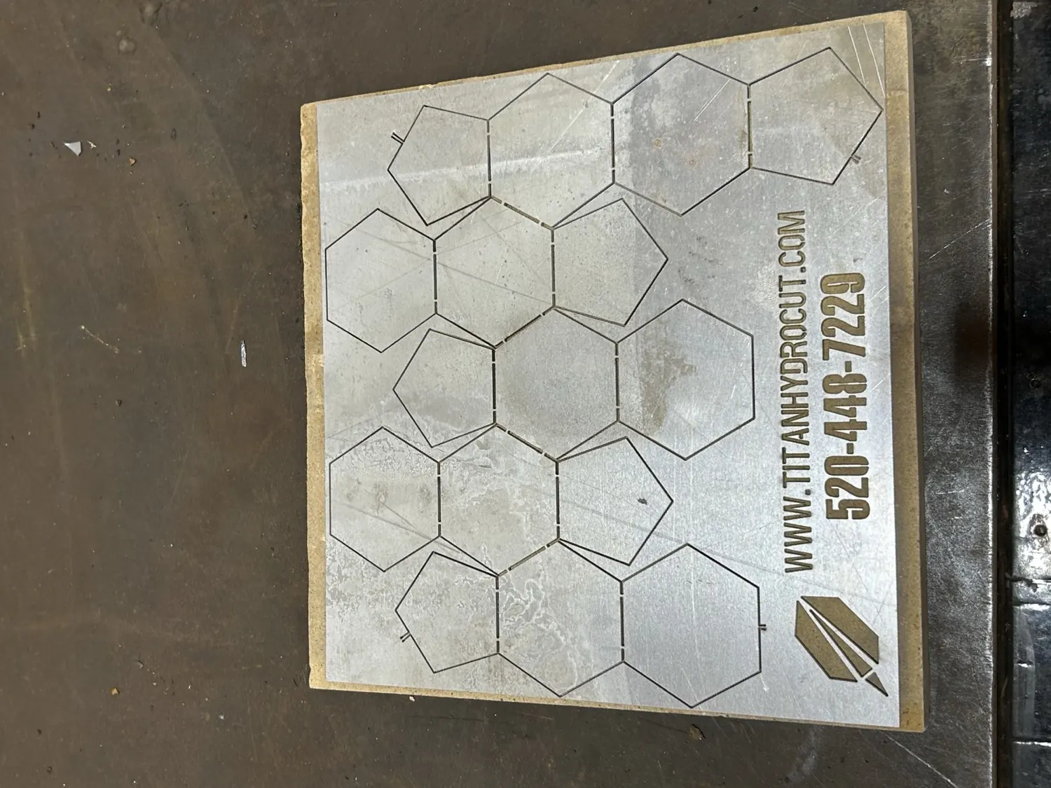 Our mark, cut clean in steel plate