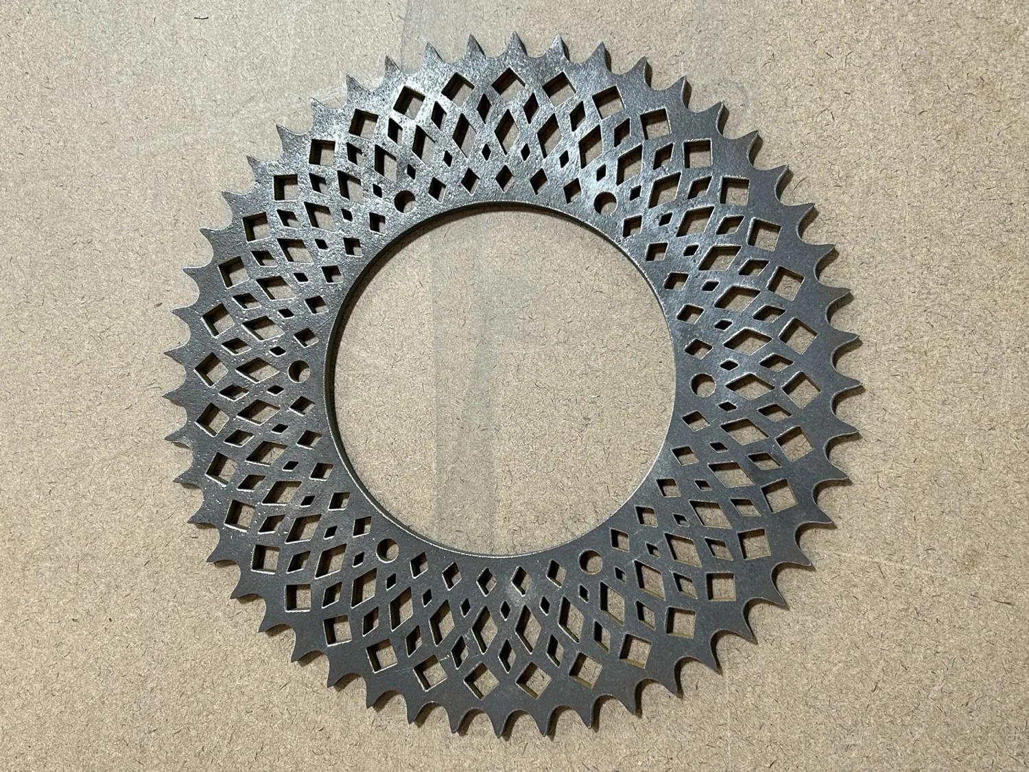 Diamond-mesh sprocket cut through steel